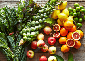 a group of fruits and vegetables on a wood surface Healthy Weight Loss Diets Chesham