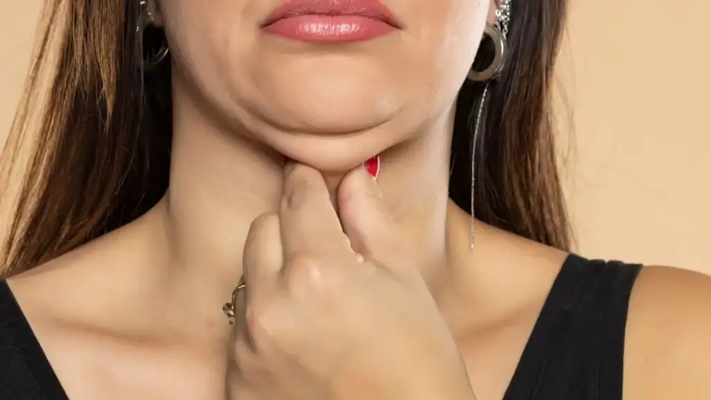 An image of a woman with double chin, sad, worried : Non Surgical Double Chin Removal Treatment in Chesham, UK